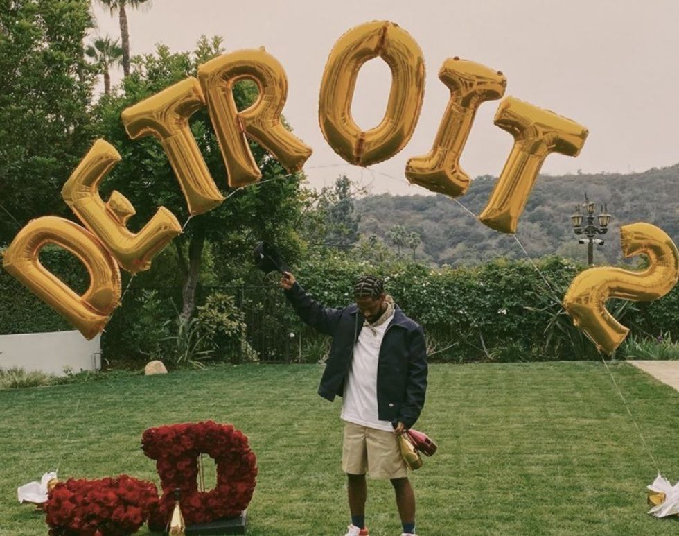 Big Sean holding Detroit 2 balloons