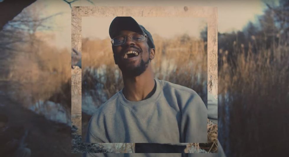 AKAI SOLO smiles in the face of chaos in the video for his new single "Ocean Hue Hours"