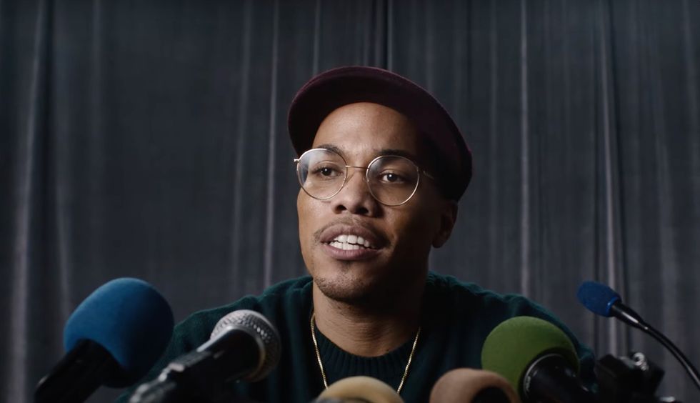 Anderson .Paak announcing his new label in a chaotic mock press briefing.