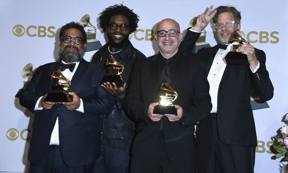 Joseph Patel, Questlove, David Dinerstein and Robert Fyvolent, winners of the Best Music Film "Summer of Soul," pose in the press room during the 64th Annual GRAMMY Awards at MGM Grand Garden Arena on April 03, 2022 in Las Vegas, Nevada.