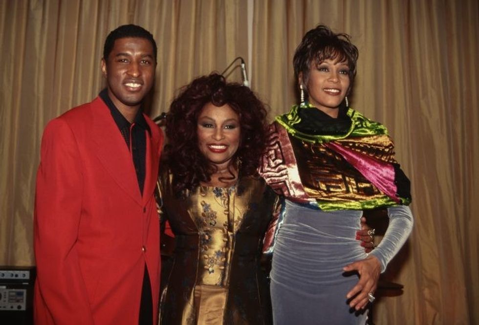 Singer Babyface in a red suit with singers Chaka and Whitney Houston wearing gowns