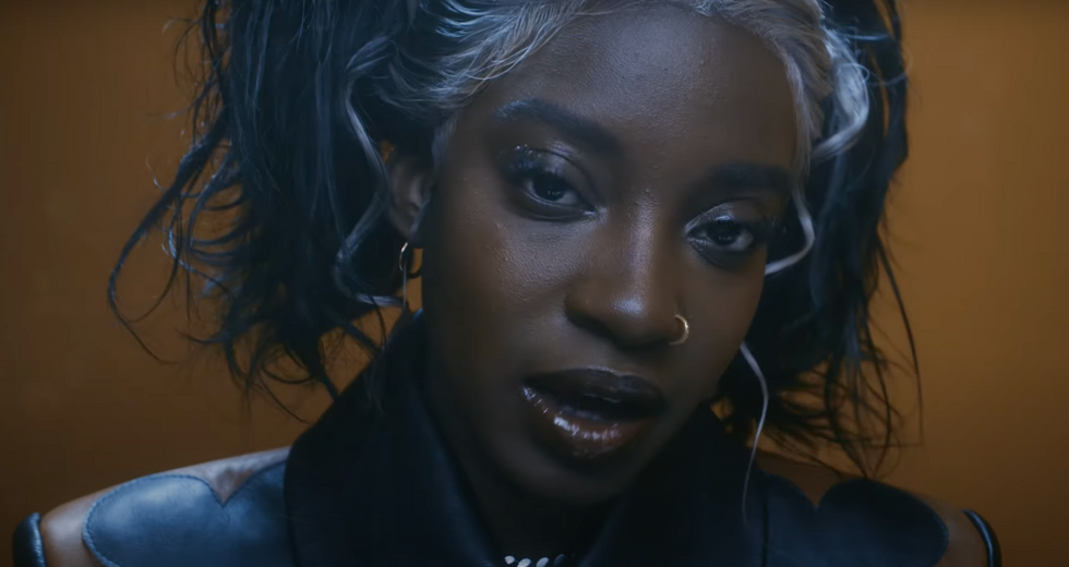 Ojerime in a visual treatment for her single "Alarming." 