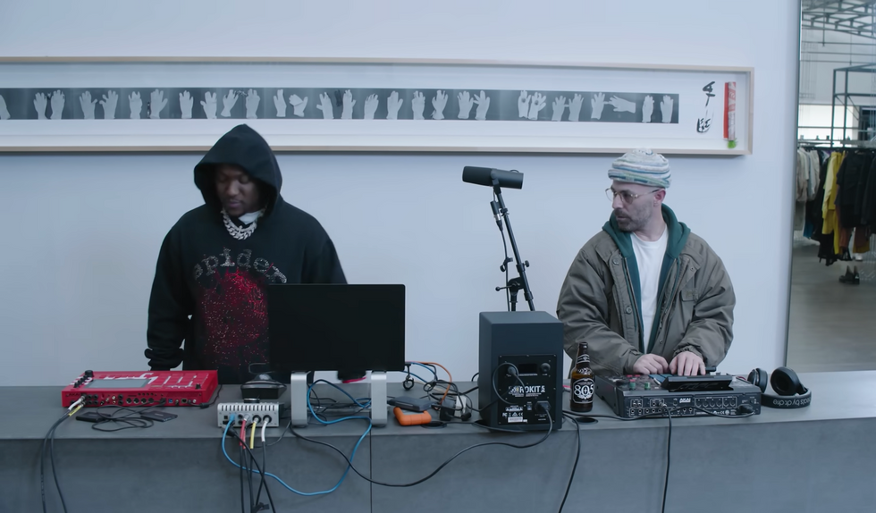 Alchemist and Hit-Boy in the video for their new single "Slipping into Darkness."