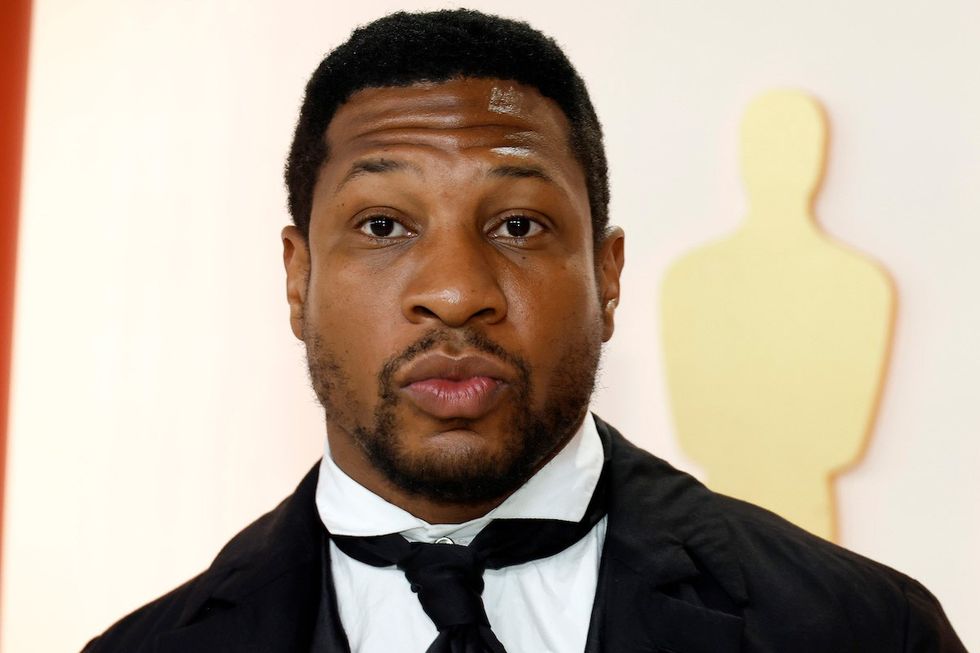 Jonathan Majors attends the 95th Annual Academy Awards on March 12, 2023 in Hollywood, California (photo by Mike Coppola/Getty Images).